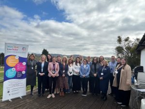 Group of people at the Worcestershire Workplace Wellbeing at Work Well Live Better Showcase delivered by Optima UK